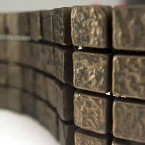 bronze_steelwooled_blackpatina_tiles.jpg